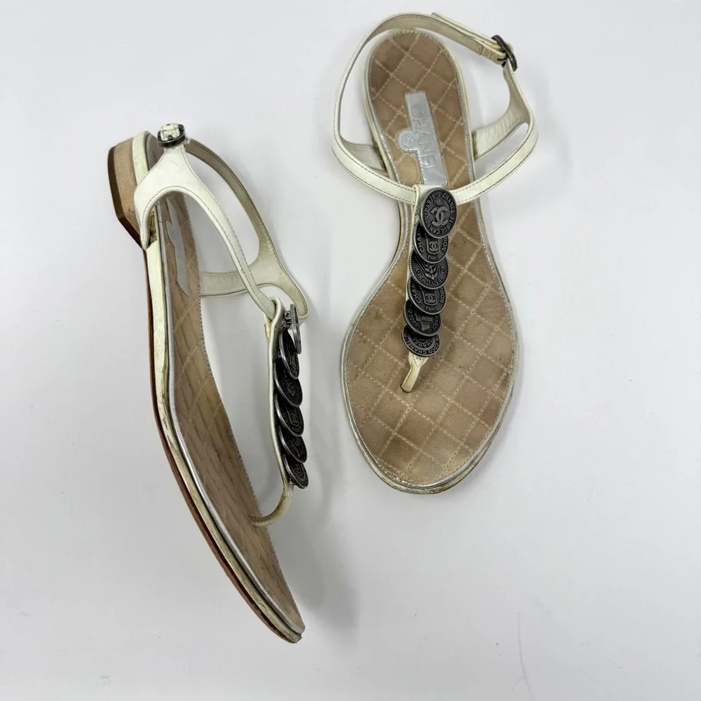 CHANEL White Leather Thong Sandals with Stacked Silver Coin Medallions